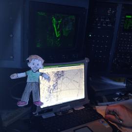 Flat Stanley Visits Antarctica - in the cockpit