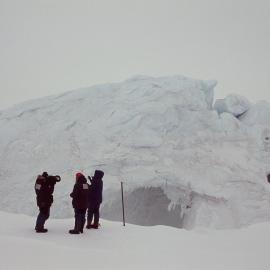 Documentary filming next to a grounded iceberg