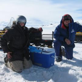 Returning surplus fish, Victoria Metcalf and Chef Basil, McMurdo Sound