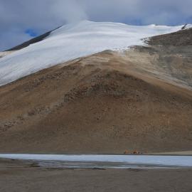 K024D campsite on the southeast shore of Lake Colleen, with Burrows Glacier in the background