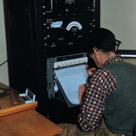 Scientist hearing record in laboratory 