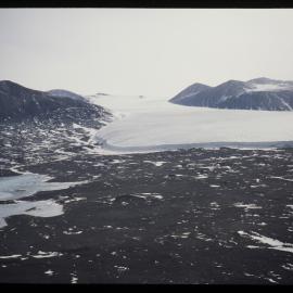 Commonwealth Glacier, Lake Fryxell, Taylor Valley. Aerial. 