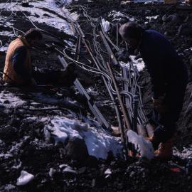 Nigel Ashcroft and Bob Dunnachie laying cables