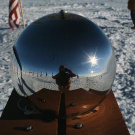 The information officer takes his photo at the Pole
