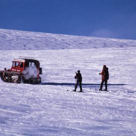 Jeremy & Jonathan Porritt skiing behind Snow Tractor