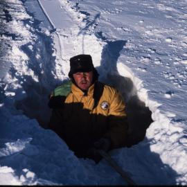 Chuck Neels in 'Garth's Hole' in front of Scott Base
