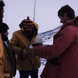 Pete Cresswell holds the tray for the rum tot