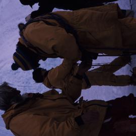 Walt Fowlie helps Steve Mosley rope up on survival training.