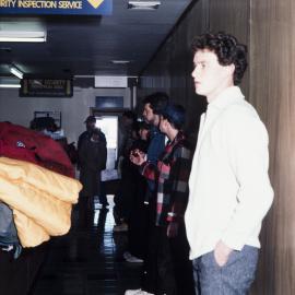 Baggage checked by dog at Mac passenger processing