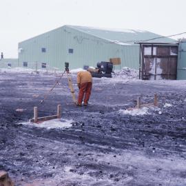 Phil Winters surveying Stage VI construction site