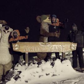 Staff, Sid and Buck at Scott Base sign