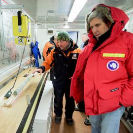U.S. Secretary of State John Kerry listens to a scientist describe his work with permafrost core samples as the Secretary toured Scott Base,