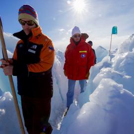 A guide leads U.S. Secretary of State John Kerry through the zone where ice crashes into land outside Scott Base