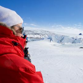 U.S. Secretary of State John Kerry looks at Weddell seals basking in the sun on the ice outside Scott Base