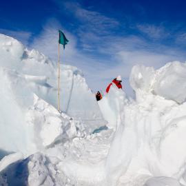 U.S. Secretary of State John Kerry walks through the zone where ice crashes into land outside Scott Base
