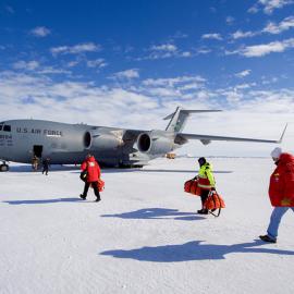 U.S. Secretary of State John Kerry approaches a waiting U.S. Air Force C-17 cargo plane at Pegasus Air Field in Antarctica, on November 12, 2016, as he prepared to depart after touring the McMurdo Station, Scott Base, and additional U.S. research faciliti