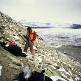 Searching for algae - snow drift amongst boulders, Rob, Victoria Valley