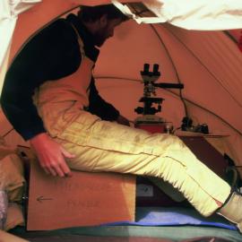 PAB at microscope in tent