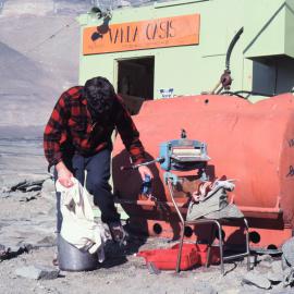 Malcolm Macfarlane doing battle with his washing
