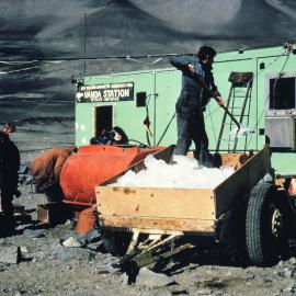 Mike Miles loading ice melter in mess hall at Vanda Station