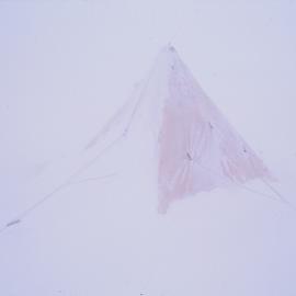 Polar tent snowed in, in blizzard/whiteout