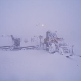 Hagglunds, loader at hitching rail, snowing