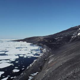 Cape Bird from Harrison Bluff. Southern penguin rookery on skyline, Shell Glacier