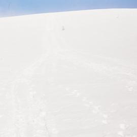 Toboggan coving down top slope 