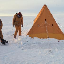 Shoveling Snow onto Flaps of Polar Tent