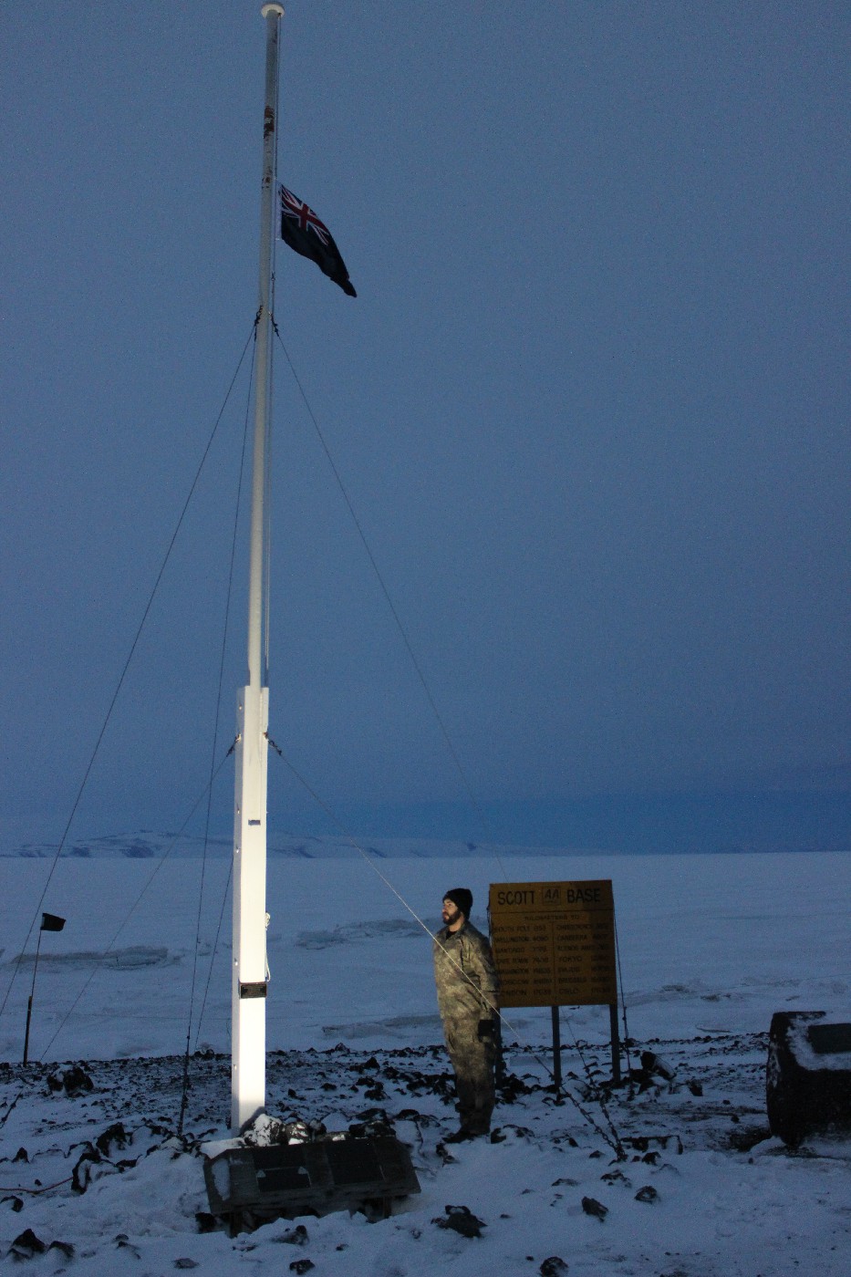 Anzac ceremony - Ben Armstrong lowering the flag